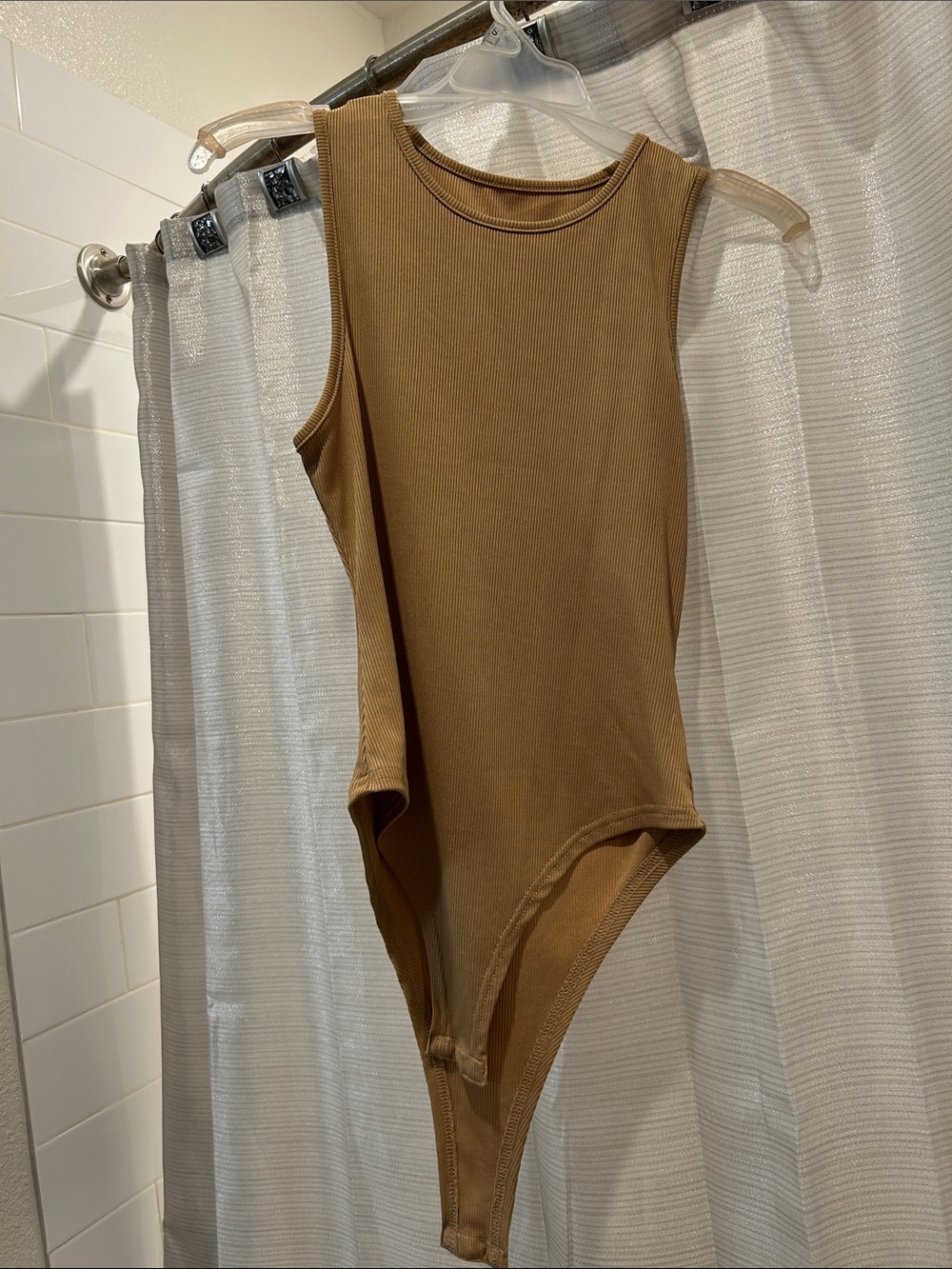 Women’s Sleeveless Ribbed One-Piece Bodysuit in camel Brown